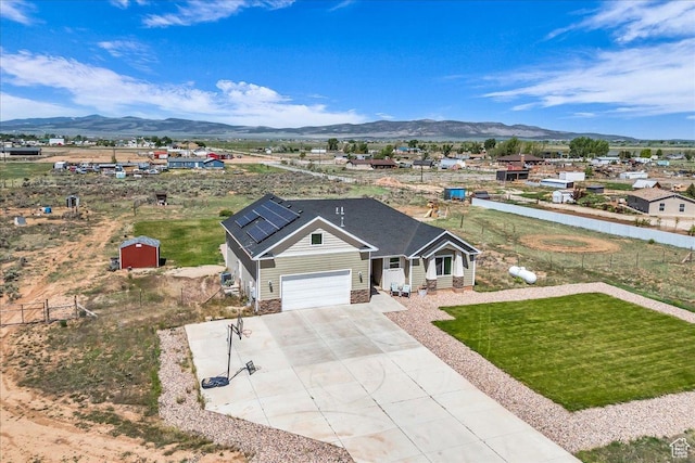 1038 S 4575 W, Cedar City, UT 84720 - view of front of property with a mountain view, concrete driveway, and a garage