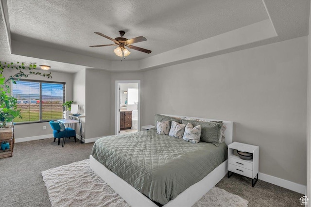 1038 S 4575 W, Cedar City, UT 84720 - carpeted bedroom with a raised ceiling, a textured ceiling, baseboards, ensuite bathroom, and ceiling fan