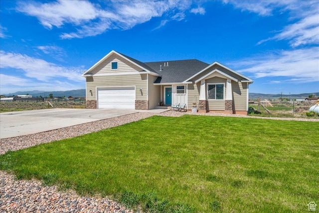 1038 S 4575 W, Cedar City, UT 84720 - view of front of property featuring stone siding, a garage, concrete driveway, and a front yard