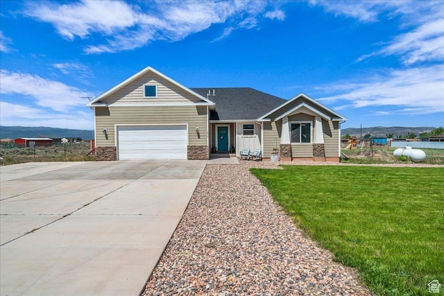 1038 S 4575 W, Cedar City, UT 84720 - view of front of property featuring concrete driveway, a garage, a front lawn, and stone siding