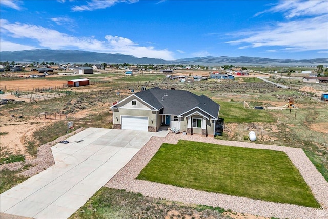 1038 S 4575 W, Cedar City, UT 84720 - view of front facade with a mountain view, driveway, a garage, and a front yard