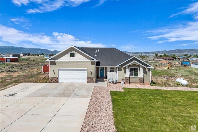 1038 S 4575 W, Cedar City, UT 84720 - view of front facade with a mountain view, driveway, and a front yard
