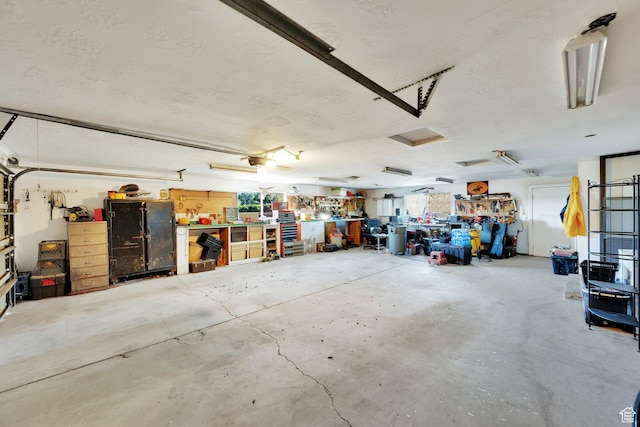 2848 N 2200 W, Salt Lake City, UT 84116 - garage with a workshop area and a garage door opener