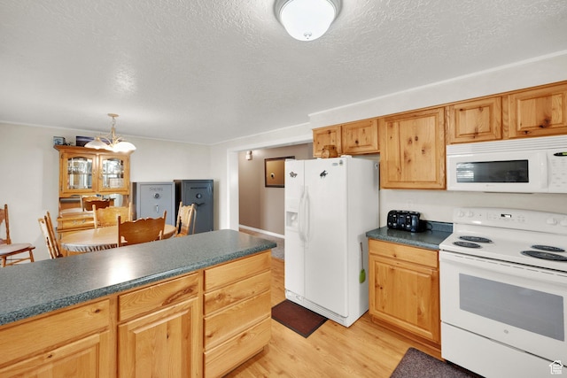 2848 N 2200 W, Salt Lake City, UT 84116 - kitchen with white appliances, dark countertops, light wood finished floors, a textured ceiling, and decorative light fixtures