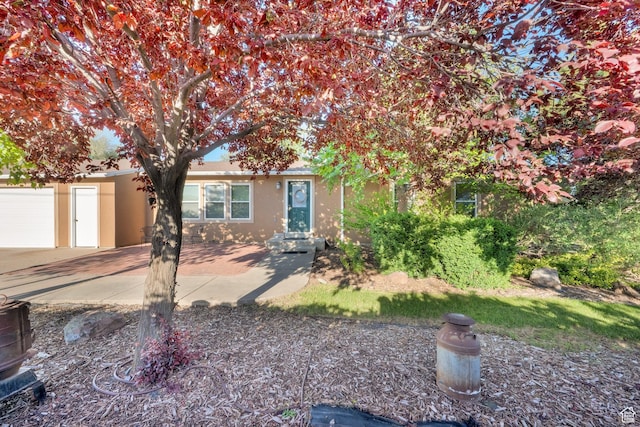 2848 N 2200 W, Salt Lake City, UT 84116 - view of front of house featuring stucco siding and concrete driveway