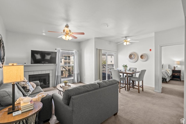 900 Bitner Rd Unit A33, Park City, UT 84098 - carpeted living area with a ceiling fan, a tile fireplace, and baseboards