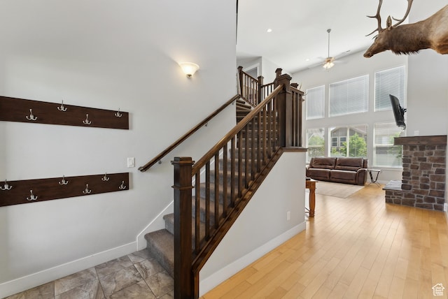 2391 S 330 E, Heber City, UT 84032 - staircase with ceiling fan, a towering ceiling, baseboards, and wood finished floors