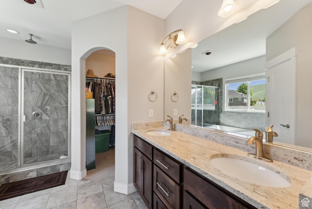 2391 S 330 E, Heber City, UT 84032 - bathroom featuring a stall shower, double vanity, a bath, tile patterned floors, and baseboards