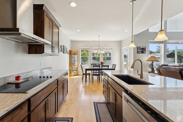 2391 S 330 E, Heber City, UT 84032 - kitchen with wall chimney exhaust hood, a sink, dishwasher, dark brown cabinets, and hanging light fixtures