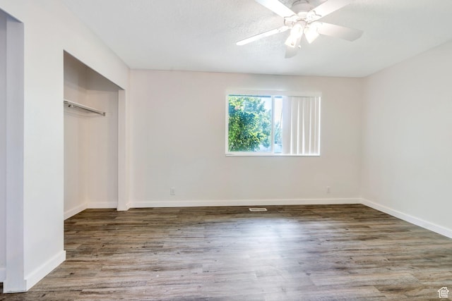 5144 W Wheatcrest Cir, West Jordan, UT 84081 - unfurnished bedroom featuring wood finished floors, baseboards, a closet, and a ceiling fan
