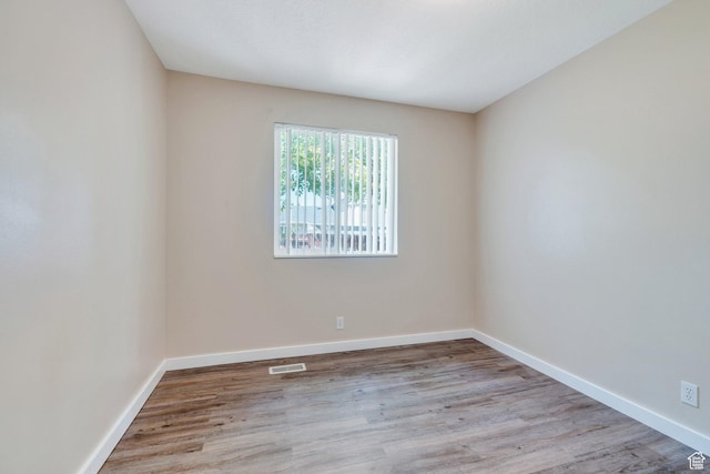 5144 W Wheatcrest Cir, West Jordan, UT 84081 - empty room featuring wood finished floors and baseboards