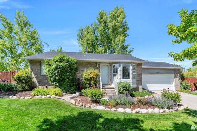 5144 W Wheatcrest Cir, West Jordan, UT 84081 - ranch-style house with a garage, brick siding, and concrete driveway