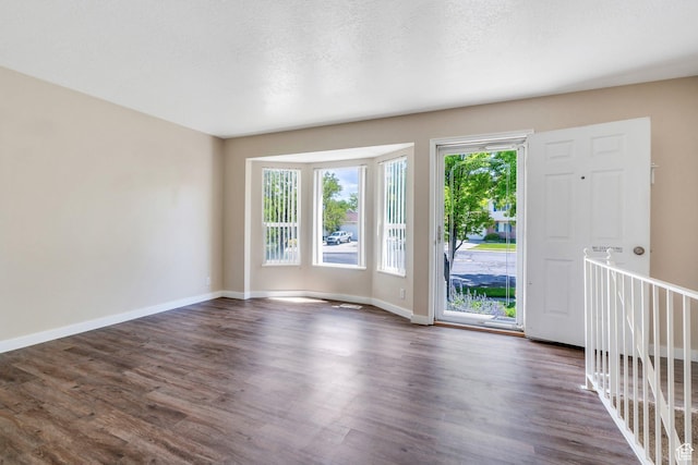5144 W Wheatcrest Cir, West Jordan, UT 84081 - entryway featuring dark wood-style flooring and baseboards