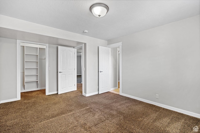 1291 E 5630 S, South Ogden, UT 84403 - unfurnished bedroom with carpet flooring, baseboards, a textured ceiling, and a closet