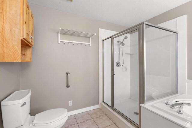 1291 E 5630 S, South Ogden, UT 84403 - bathroom featuring toilet, a stall shower, tile patterned floors, and baseboards