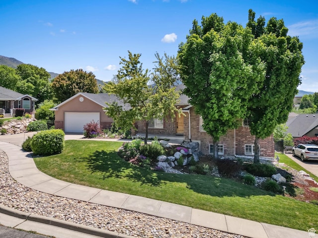 1291 E 5630 S, South Ogden, UT 84403 - view of property hidden behind natural elements featuring brick siding, a front lawn, concrete driveway, and an attached garage
