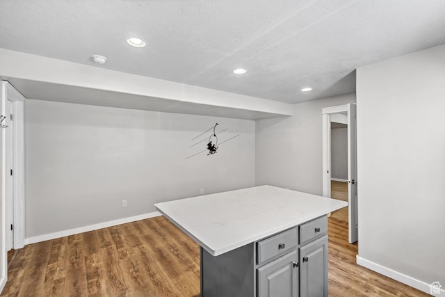 1291 E 5630 S, South Ogden, UT 84403 - finished below grade area featuring baseboards, light wood-type flooring, recessed lighting, and a textured ceiling