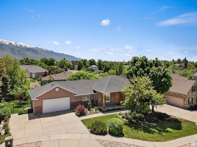 1291 E 5630 S, South Ogden, UT 84403 - ranch-style house featuring driveway, a garage, stone siding, a mountain view, and brick siding