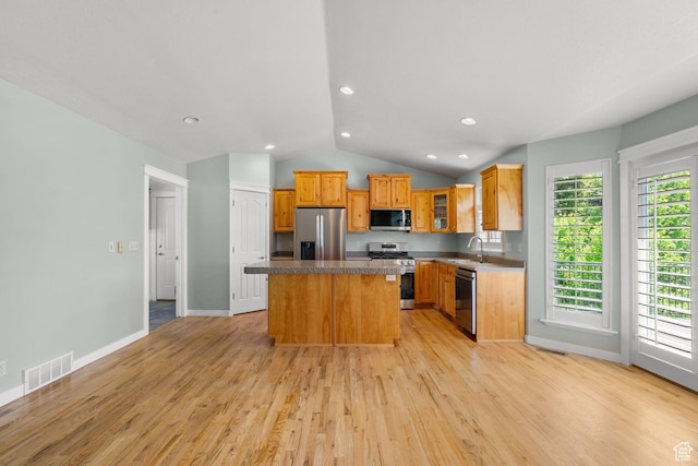 1291 E 5630 S, South Ogden, UT 84403 - kitchen with appliances with stainless steel finishes, a sink, a center island, lofted ceiling, and light wood-style flooring