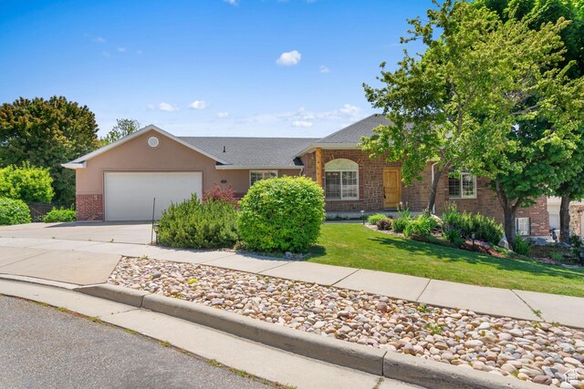 1291 E 5630 S, South Ogden, UT 84403 - ranch-style house featuring brick siding, an attached garage, driveway, and a front lawn