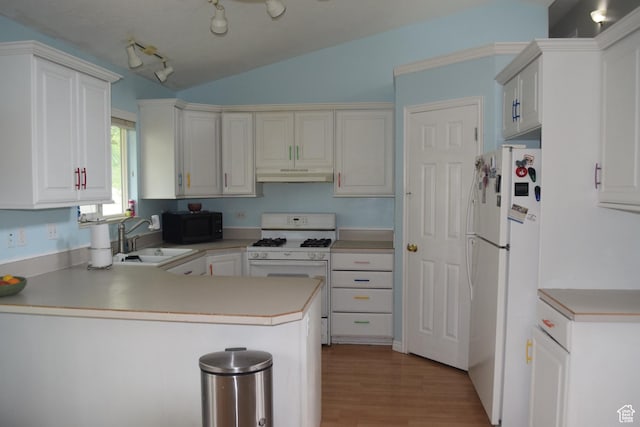 963 W Rainbow Dr, Logan, UT 84321 - kitchen with white appliances, under cabinet range hood, a sink, a peninsula, and vaulted ceiling