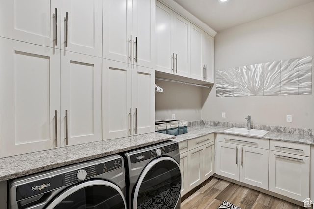 3858 E Eagle Ct, Eden, UT 84310 - laundry room with washer and dryer, cabinet space, and light wood-type flooring