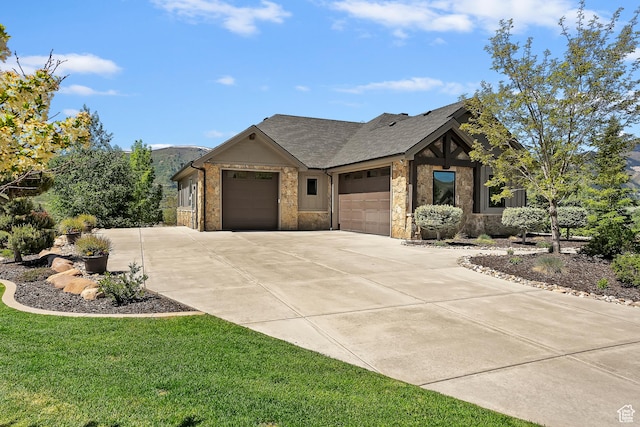 3858 E Eagle Ct, Eden, UT 84310 - view of front facade featuring a garage, concrete driveway, a front lawn, and stone siding