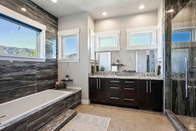 3858 E Eagle Ct, Eden, UT 84310 - full bath featuring a garden tub, double vanity, a stall shower, healthy amount of natural light, and recessed lighting