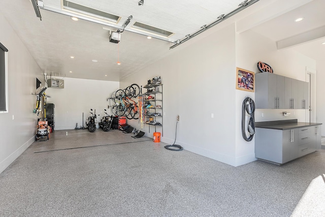 3858 E Eagle Ct, Eden, UT 84310 - garage with a garage door opener, baseboards, and recessed lighting