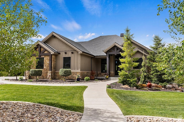 3858 E Eagle Ct, Eden, UT 84310 - craftsman-style home with board and batten siding, a front yard, stone siding, and roof with shingles