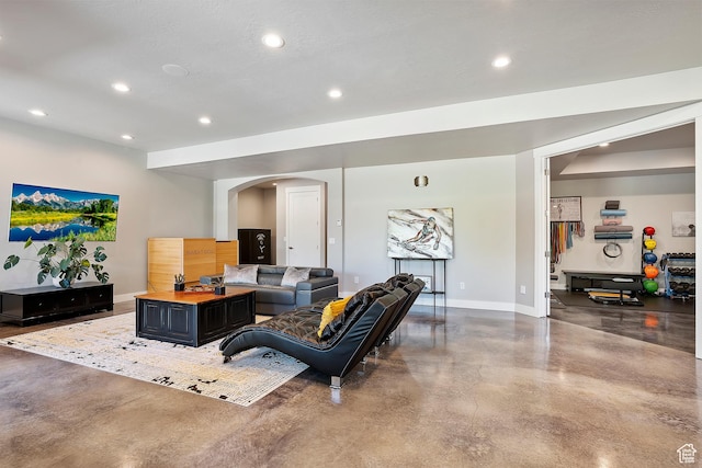 3858 E Eagle Ct, Eden, UT 84310 - living area with concrete flooring, baseboards, arched walkways, and recessed lighting