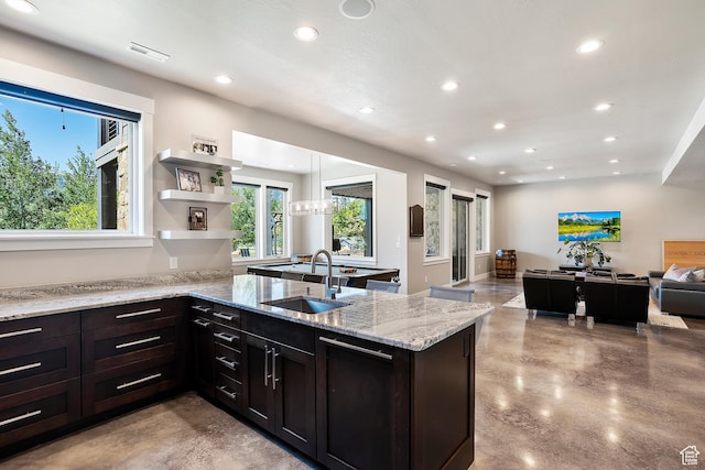 3858 E Eagle Ct, Eden, UT 84310 - kitchen featuring a sink, finished concrete floors, recessed lighting, open floor plan, and a peninsula