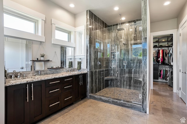 3858 E Eagle Ct, Eden, UT 84310 - full bathroom featuring a stall shower, double vanity, recessed lighting, and a walk in closet