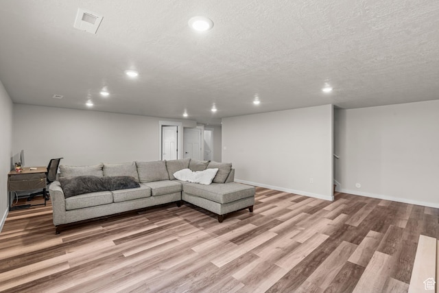 3932 S Sennie Dr W, Magna, UT 84044 - living area featuring recessed lighting, light wood finished floors, a textured ceiling, and baseboards