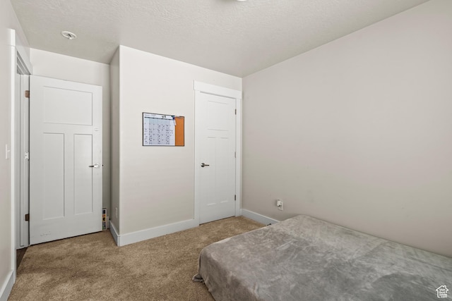 3932 S Sennie Dr W, Magna, UT 84044 - bedroom with carpet, baseboards, and a textured ceiling