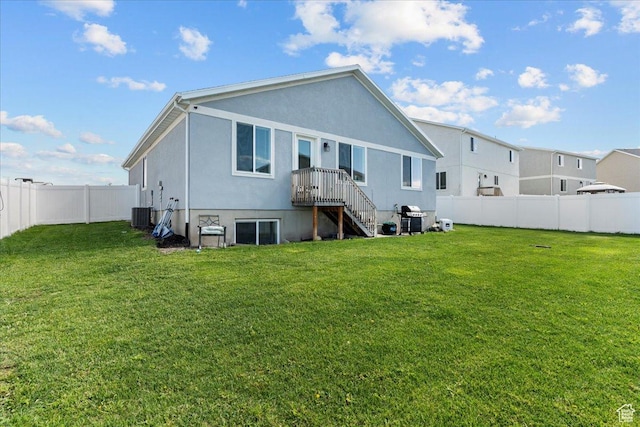 3932 S Sennie Dr W, Magna, UT 84044 - rear view of property featuring stucco siding and cooling unit