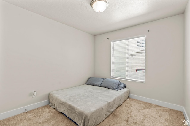 3932 S Sennie Dr W, Magna, UT 84044 - carpeted bedroom featuring baseboards and a textured ceiling