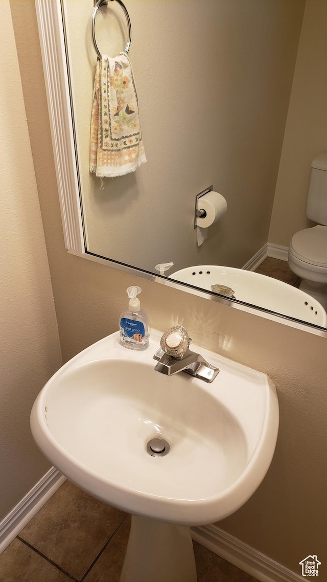 125 W 870 N, Orem, UT 84057 - half bathroom with toilet, tile patterned flooring, and a sink