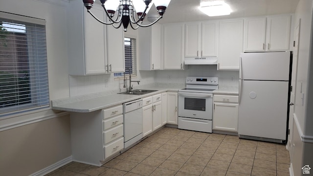 125 W 870 N, Orem, UT 84057 - kitchen featuring white appliances, under cabinet range hood, a sink, and white cabinetry