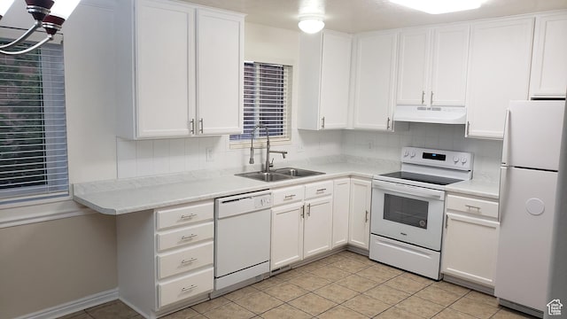 125 W 870 N, Orem, UT 84057 - kitchen with white appliances, under cabinet range hood, a sink, and decorative backsplash