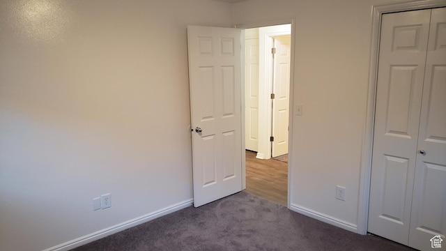 125 W 870 N, Orem, UT 84057 - unfurnished bedroom with baseboards, dark colored carpet, and a closet