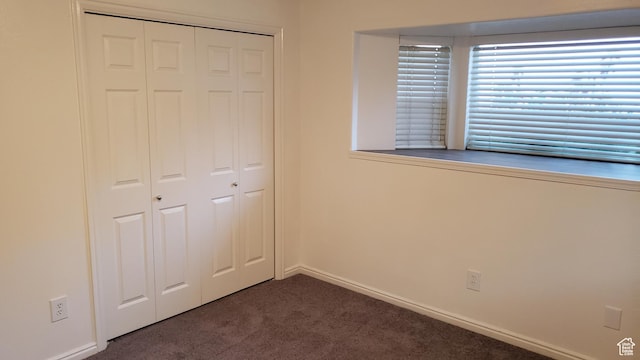125 W 870 N, Orem, UT 84057 - unfurnished bedroom featuring a closet, carpet floors, and baseboards
