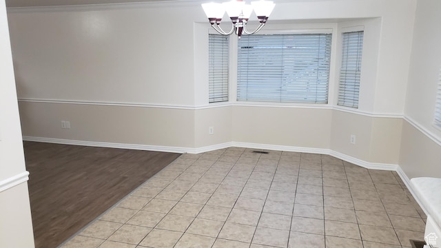 125 W 870 N, Orem, UT 84057 - unfurnished dining area featuring a chandelier, tile patterned flooring, and baseboards