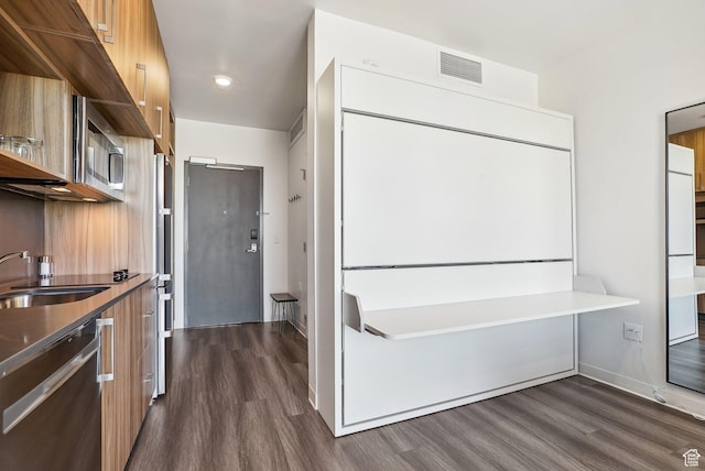 2670 Canyons Resort Dr Unit 319, Park City, UT 84098 - kitchen with modern cabinets, appliances with stainless steel finishes, dark wood-style flooring, a sink, and recessed lighting