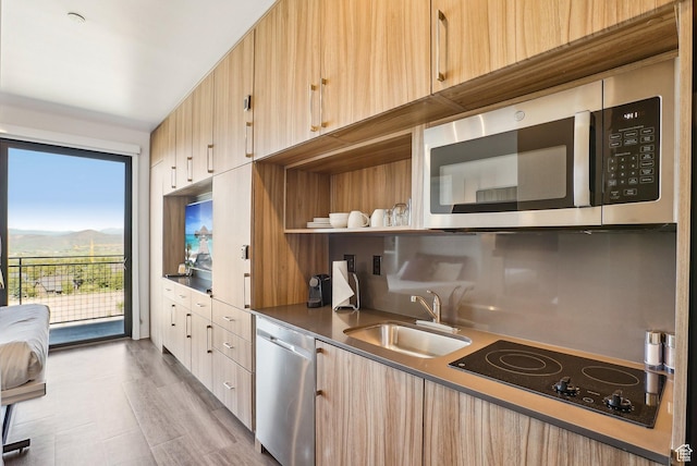 2670 Canyons Resort Dr Unit 319, Park City, UT 84098 - kitchen featuring appliances with stainless steel finishes, a sink, light brown cabinets, dark countertops, and a mountain view