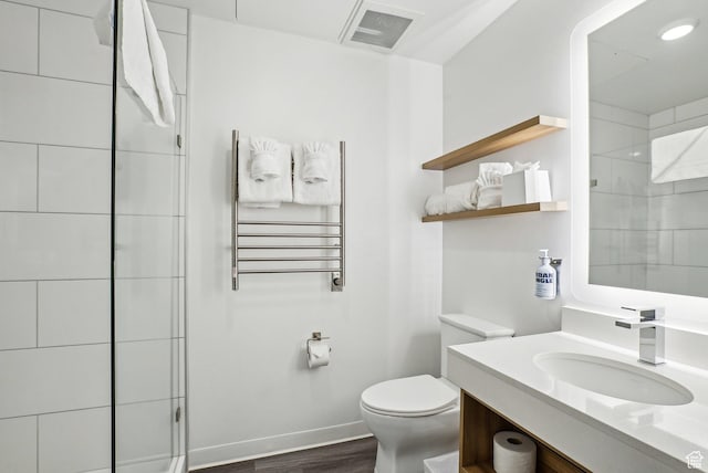 2670 Canyons Resort Dr Unit 319, Park City, UT 84098 - full bath with radiator heating unit, vanity, toilet, wood finished floors, and tiled shower