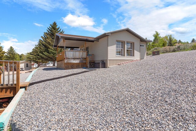 3058 S Edgemont Dr Unit 253, 54, Garden City, UT 84028 - view of home's exterior with a porch and central AC
