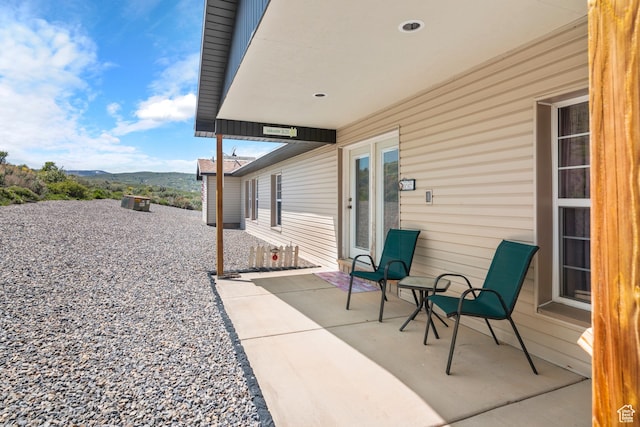 3058 S Edgemont Dr Unit 253, 54, Garden City, UT 84028 - view of patio featuring a mountain view