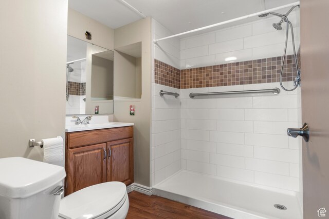 3058 S Edgemont Dr Unit 253, 54, Garden City, UT 84028 - full bath featuring toilet, vanity, tiled shower, and wood finished floors