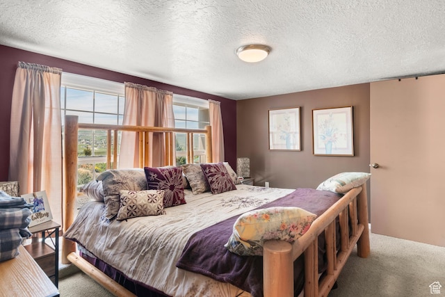 3058 S Edgemont Dr Unit 253, 54, Garden City, UT 84028 - bedroom with a textured ceiling and carpet